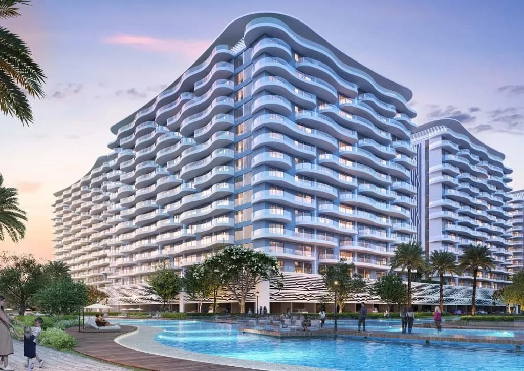 Lagoon Views Phase 3 at DAMAC Lagoons — wave-balcony apartment towers on the lagoon at dusk